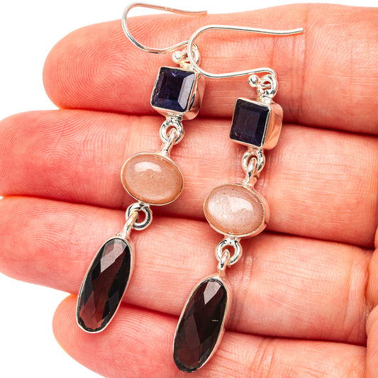 Sterling silver drop earrings: blue square, peach round, dark faceted teardrop stones