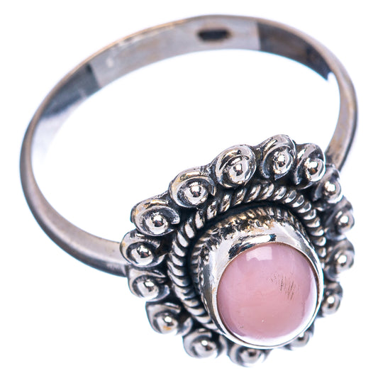 Sterling silver ring with pink oval opal and detailed beaded side band