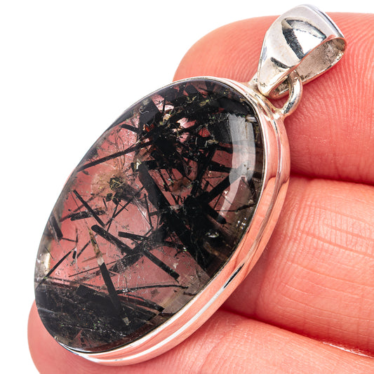 Tourmalated quartz pendant, oval dark crystal-studded cabochon in silver-toned bail