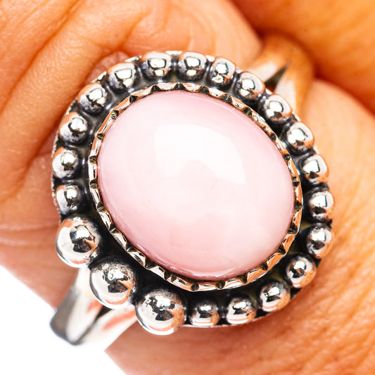 Sterling silver pink opal cabochon ring with beaded bezel and round pink stone