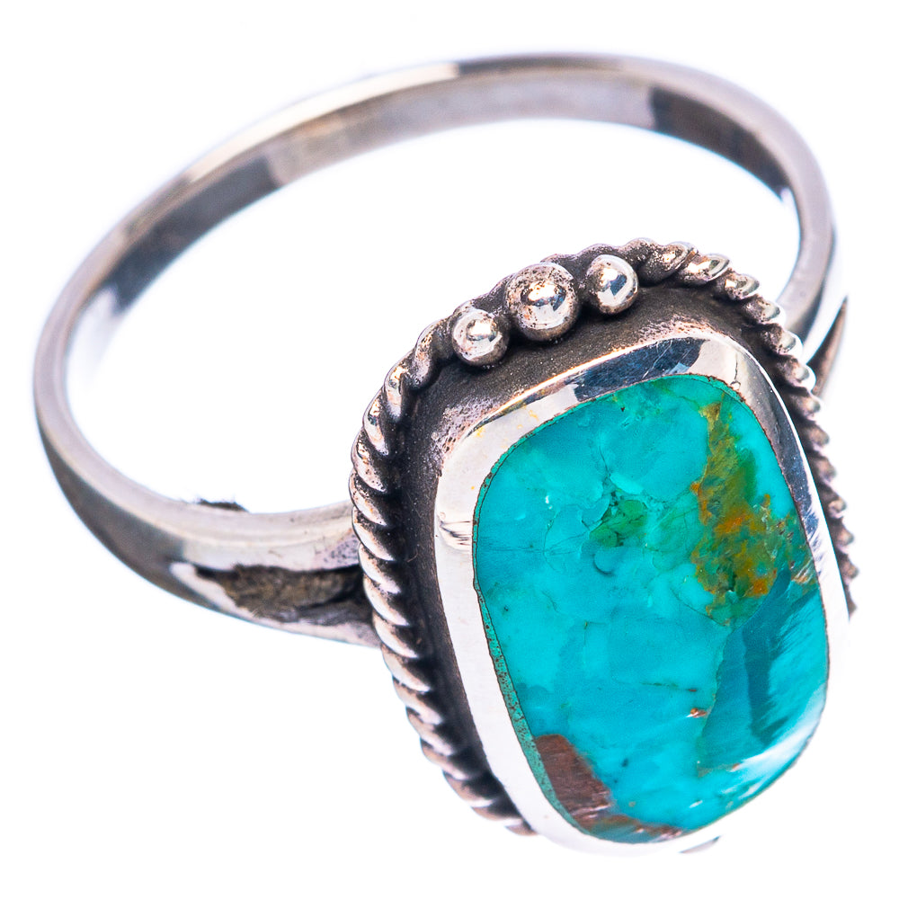 Sterling silver turquoise oval cabochon ring, side view with raised bead details.