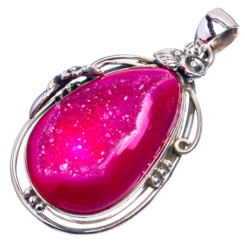 Oval pink drusy agate pendant in silver-tone frame with decorative bail and ring loops
