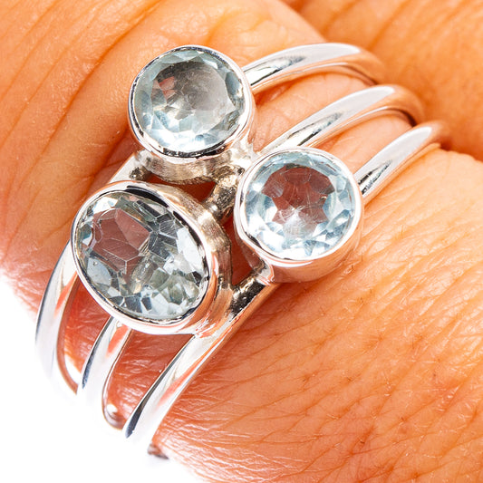 Sterling silver ring with three round blue topaz stones on hand, size 8.75
