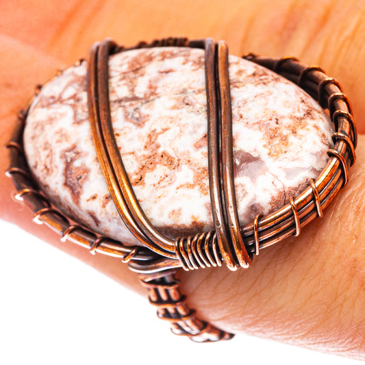 Oxidized copper wire ring with oval white-and-red rosetta jasper stone