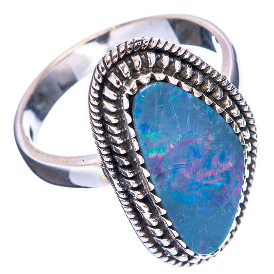 Oval blue opal doublet ring in sterling silver, braided bezel with raised edge