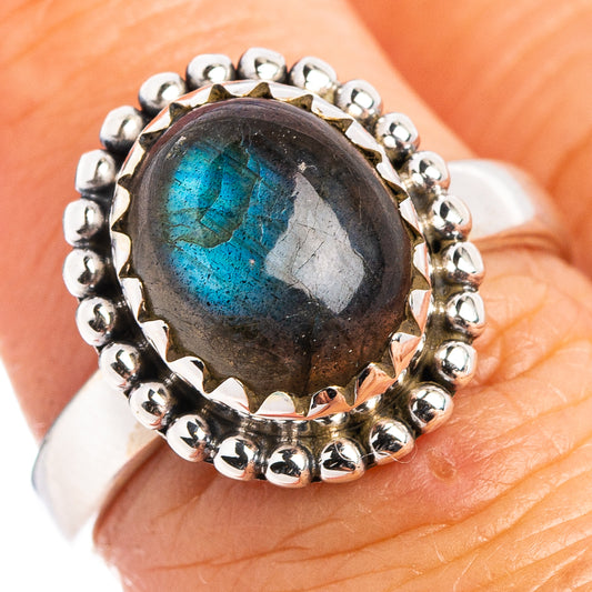 Sterling silver labradorite cabochon ring showing blue flash, beaded silver band