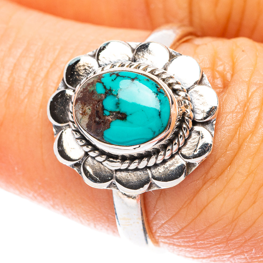 Sterling silver dainty ring with oval turquoise stone and floral petal setting