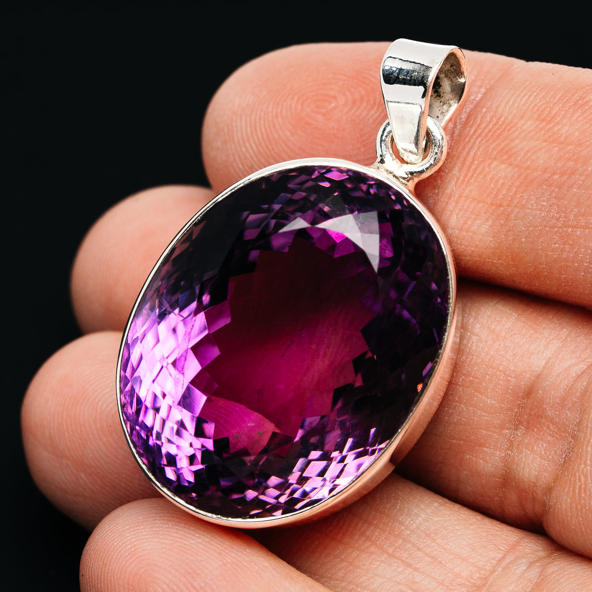 Oval faceted amethyst pendant in .925 sterling silver with polished bail