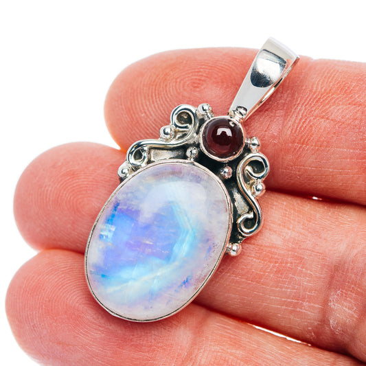 925 sterling silver pendant with oval rainbow moonstone and small red garnet