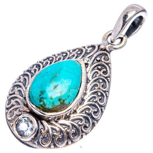 Sterling silver turquoise teardrop pendant with ornate filigree and small clear accents
