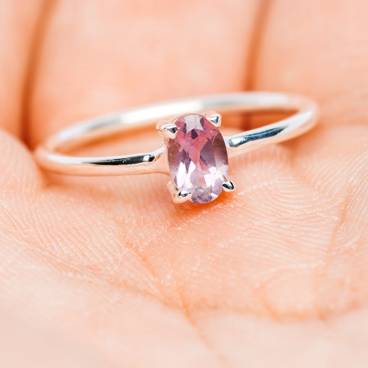 Amethyst stackable sterling silver ring with faceted oval gemstone on slim band