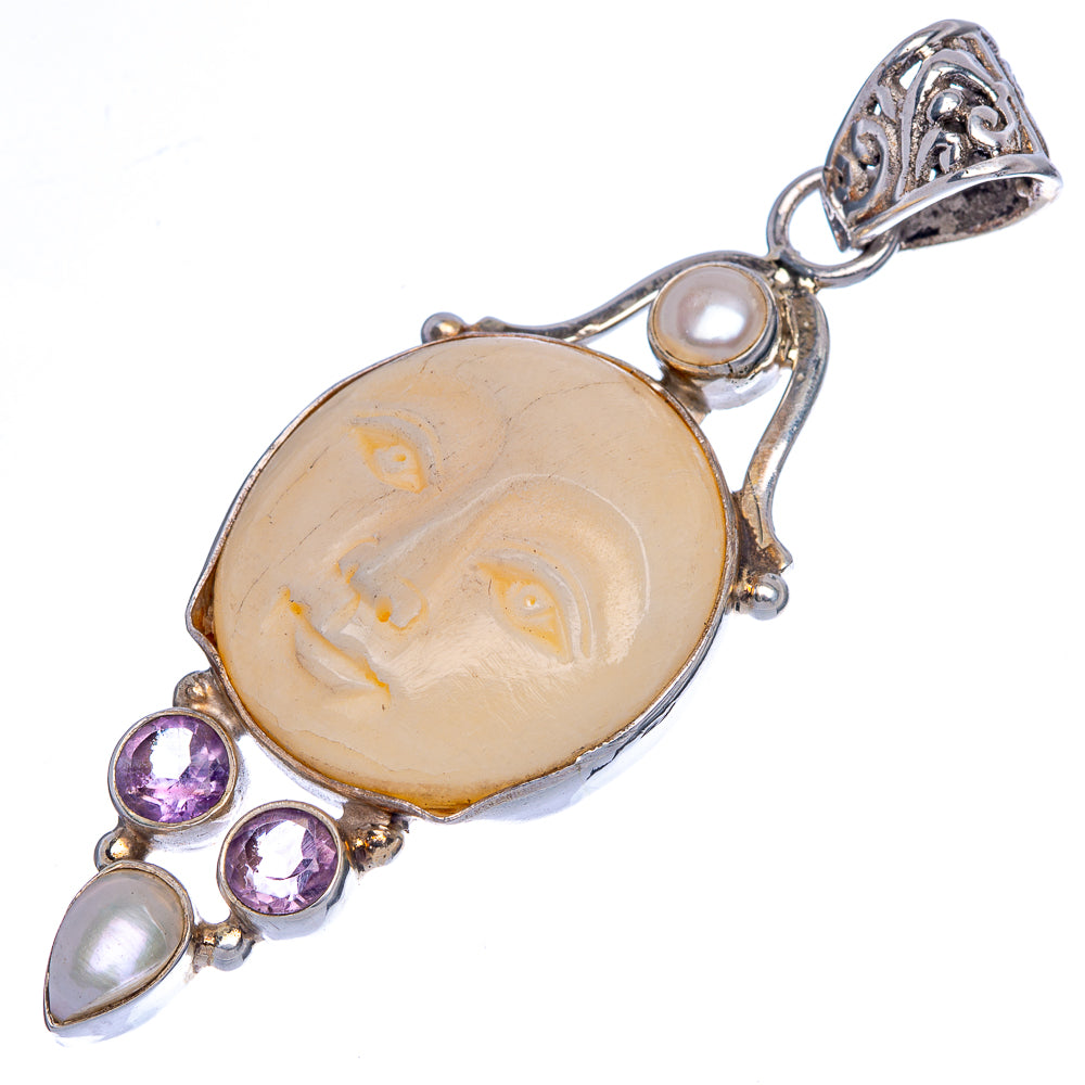 Sterling silver pendant with oval amethyst and carved face center, cultured pearl accents