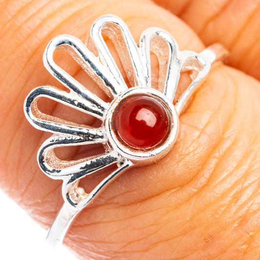 Sterling silver dainty daisy ring with red cabochon center.