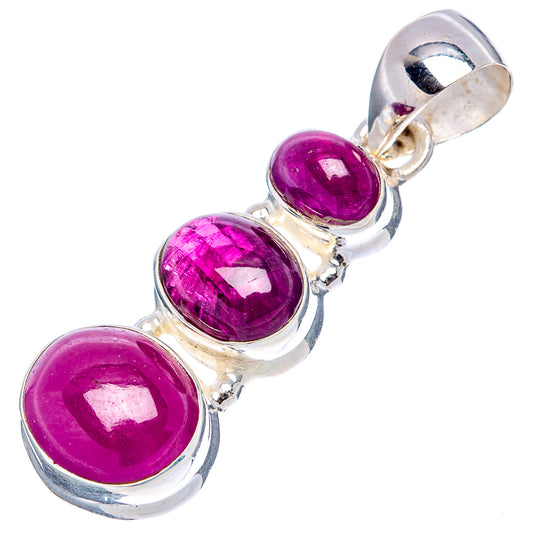 Three-stone ruby pendant in sterling silver with oval faceted purple gemstones.