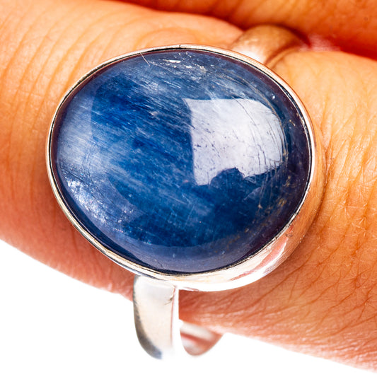 Oval blue kyanite gemstone ring in .925 sterling silver, close-up on finger