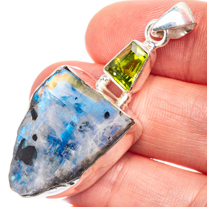 Sterling silver pendant with raw blue moonstone and green square peridot, close-up