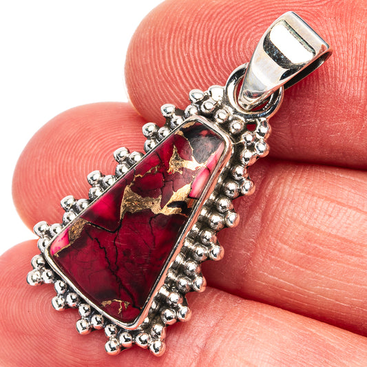 Sterling silver pendant with rectangular red stone, gold veining, beaded frame and bail
