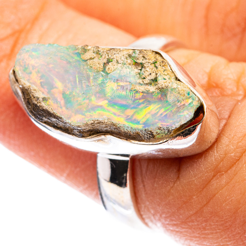 Sterling silver ring with raw Ethiopian opal, iridescent green and orange face