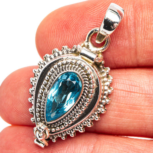 925 sterling silver pendant with oval bezel set blue gemstone and ornate border