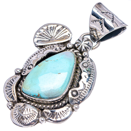 Ornate turquoise teardrop .925 sterling silver pendant with engraved border and bail