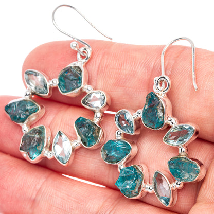 Sterling silver drop earrings with rough blue stones and hook backs
