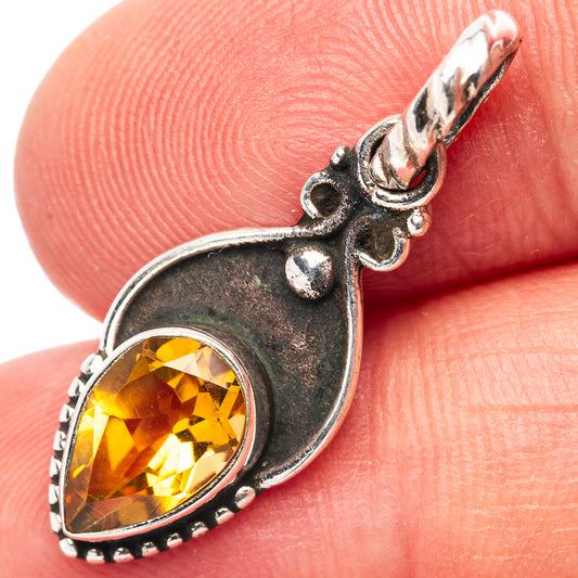 Sterling silver citrine oval pendant with teardrop bezel and beaded edge detail