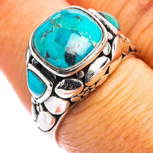 Sterling silver ring with large turquoise oval stone and small turquoise accents, engraved sides