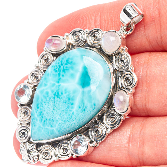 Oval larimar-style pendant in .925 sterling silver with turquoise stone and moonstone accents