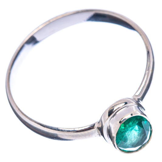 Bezel-set oval green emerald ring in .925 sterling silver band with rounded shoulders