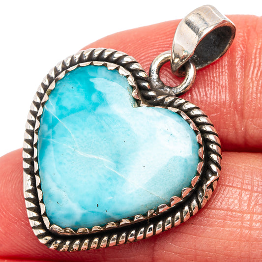 Heart-shaped larimar pendant in .925 sterling silver with rope border and loop bail.