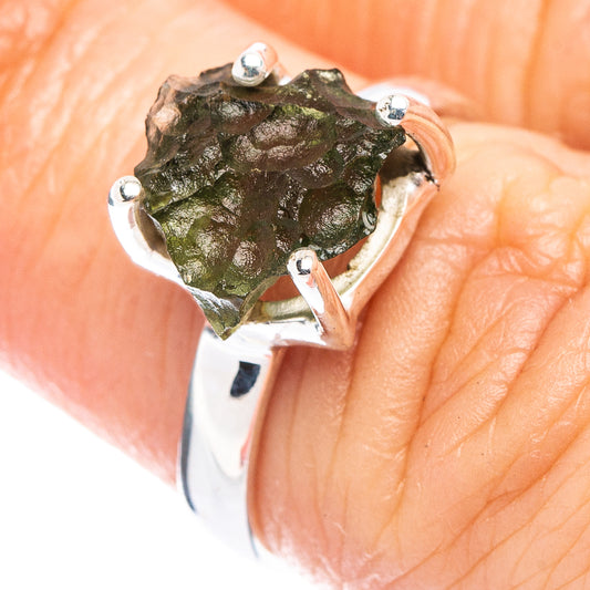 Sterling silver moldavite ring with green rough stone and four prong settings