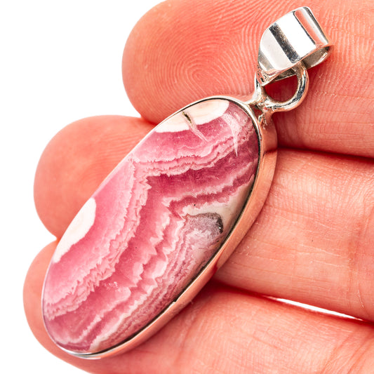 Oval rhodochrosite pendant in oval cabochon with .925 sterling silver bail, pink stripes