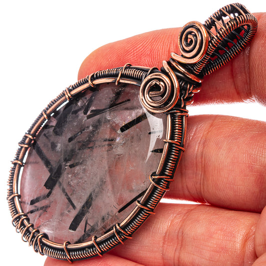 Oxidized copper wire-wrapped teardrop quartz pendant, black tourmaline inclusions