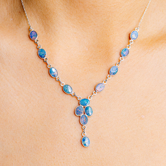 Sterling silver opal necklace with oval blue opal links and small drop pendant