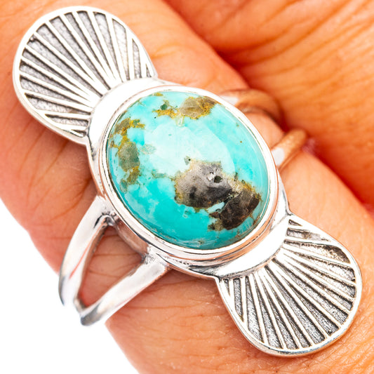 Sterling silver ring with oval turquoise cabochon and fan-like side detailing
