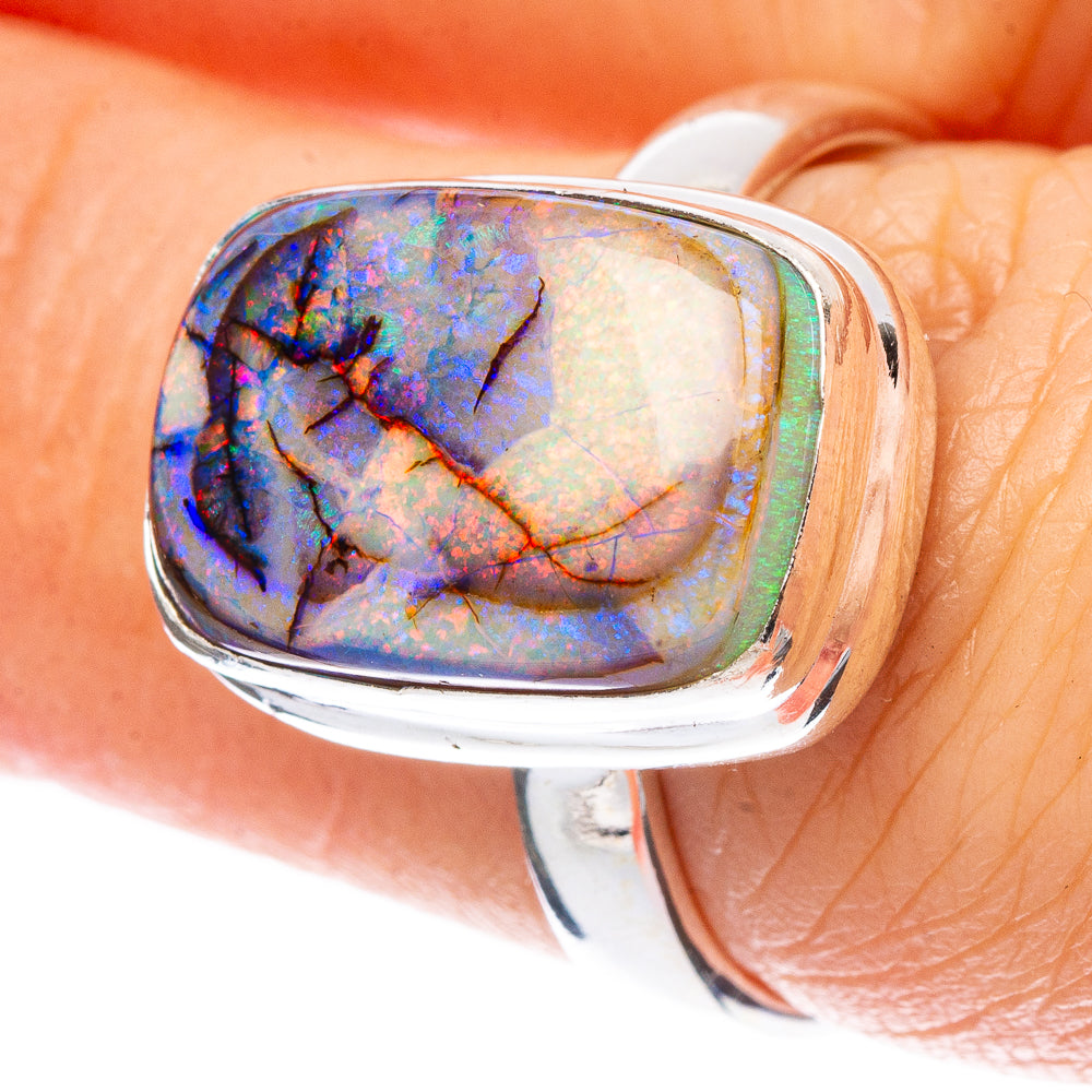 Sterling silver opal ring with oval bezel, blue and purple iridescent stone