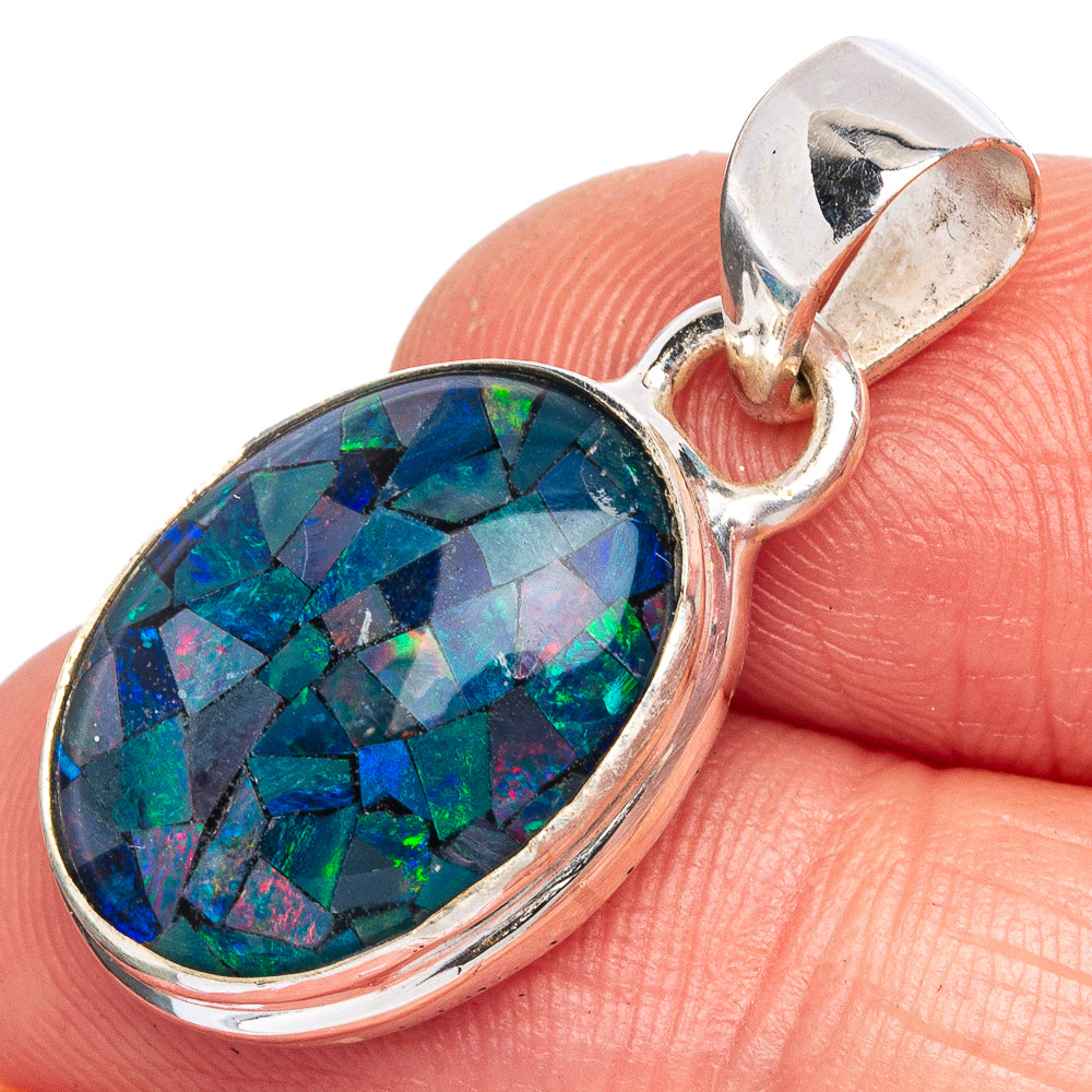 Oval opal pendant in sterling silver bezel with iridescent blue-green-red stone