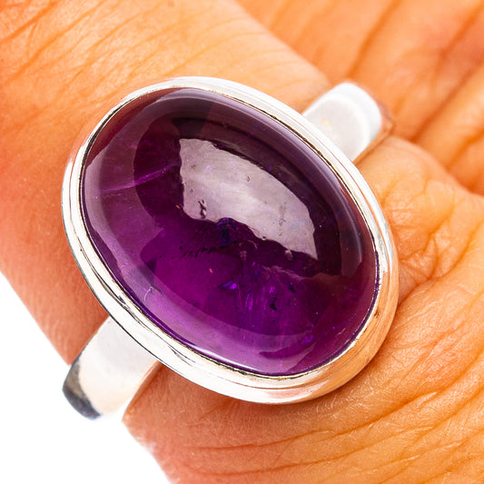 Amethyst sterling silver ring with oval purple gemstone cabochon and polished band