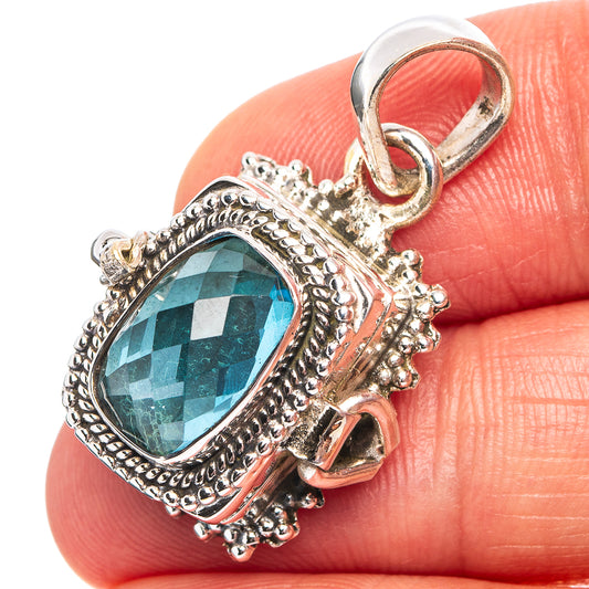 Sterling silver pendant with oval blue topaz-style gemstone and hinged bail