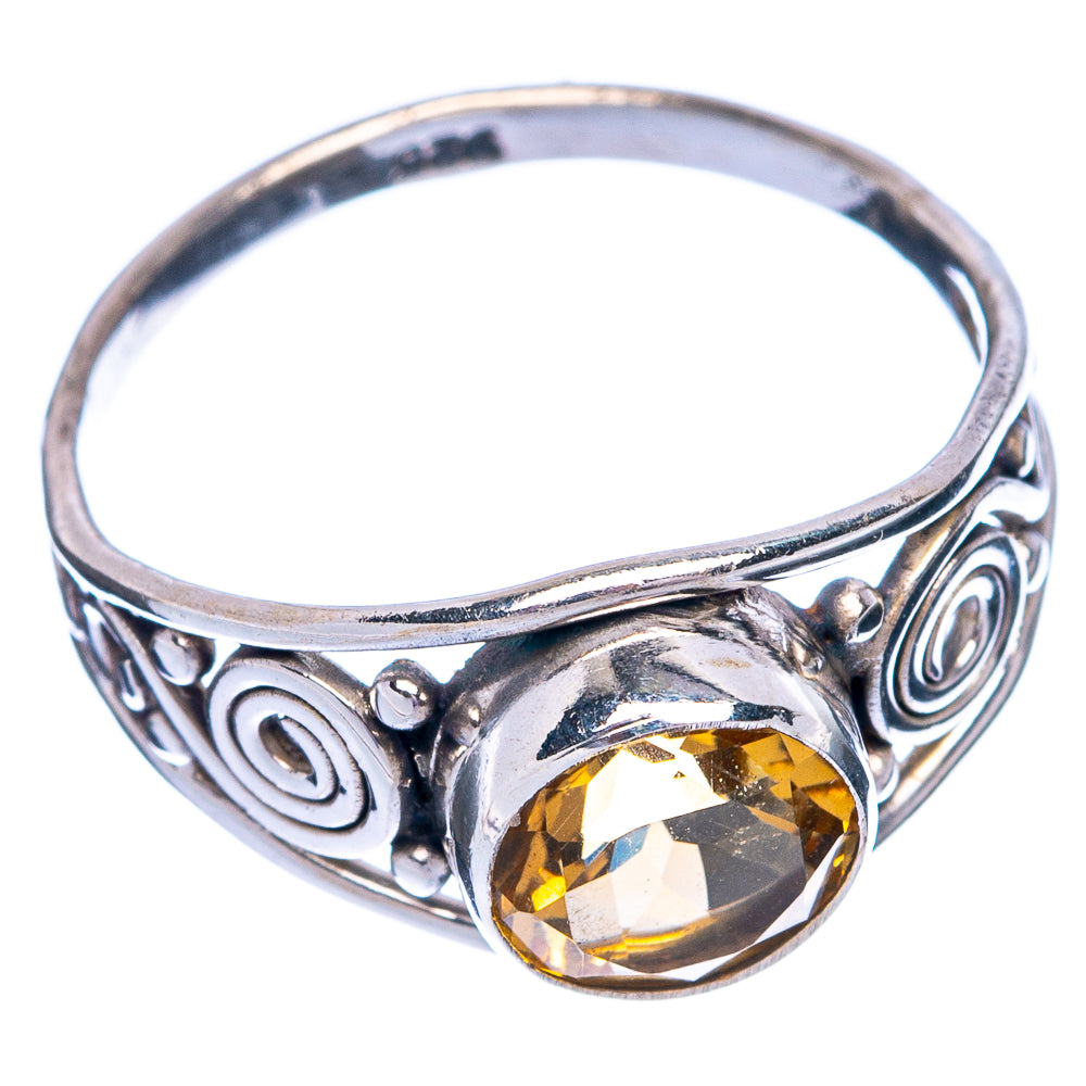 Sterling silver ring with oval faceted citrine and decorative spiral band detail