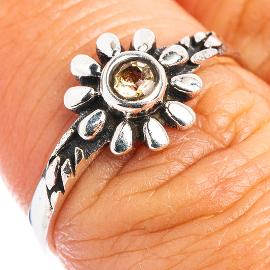 Dainty sterling silver flower ring with citrine-colored round center, size 6.75