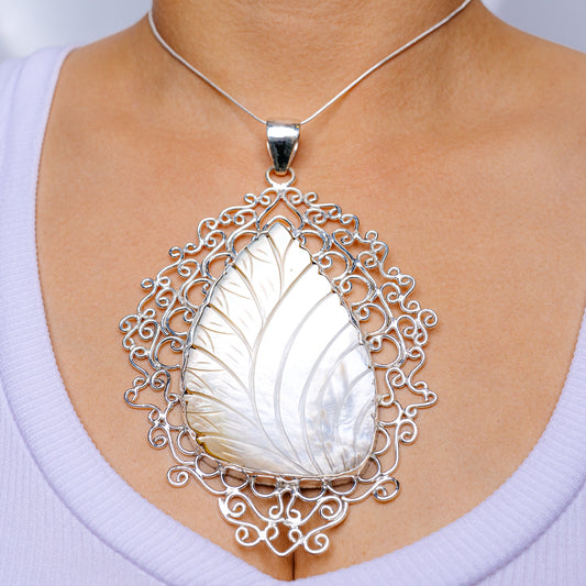 Mother-of-pearl pendant in ornate .925 sterling silver filigree, teardrop design