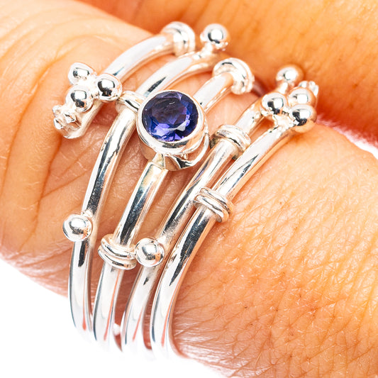 Sterling silver tanzanite ring with round blue-purple gemstone and raised prong setting