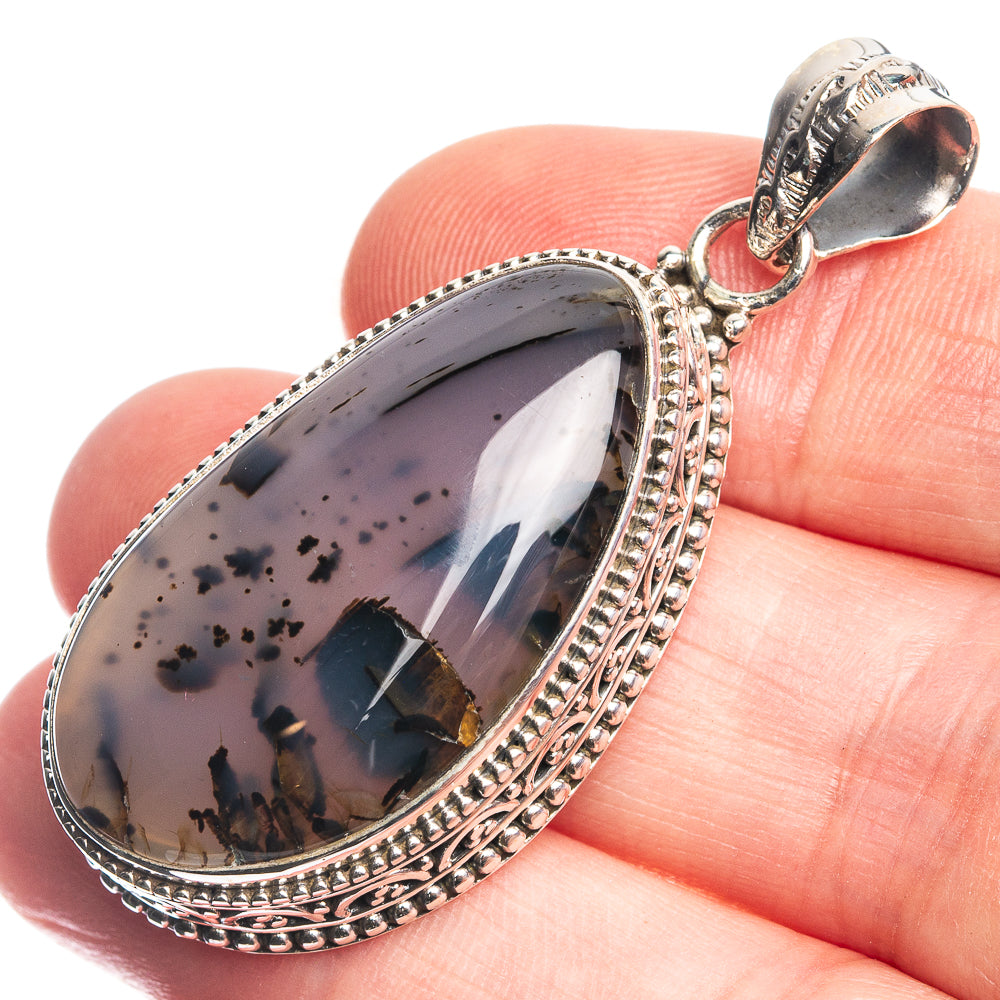 Sterling silver teardrop pendant with palm wood jasper cabochon and detailed bezel