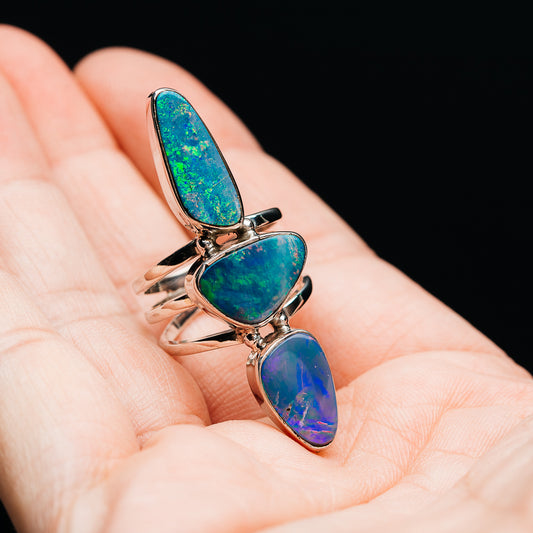 Opal doublet ring with three elongated teardrop opals in blue-green and blue-purple, sterling silver