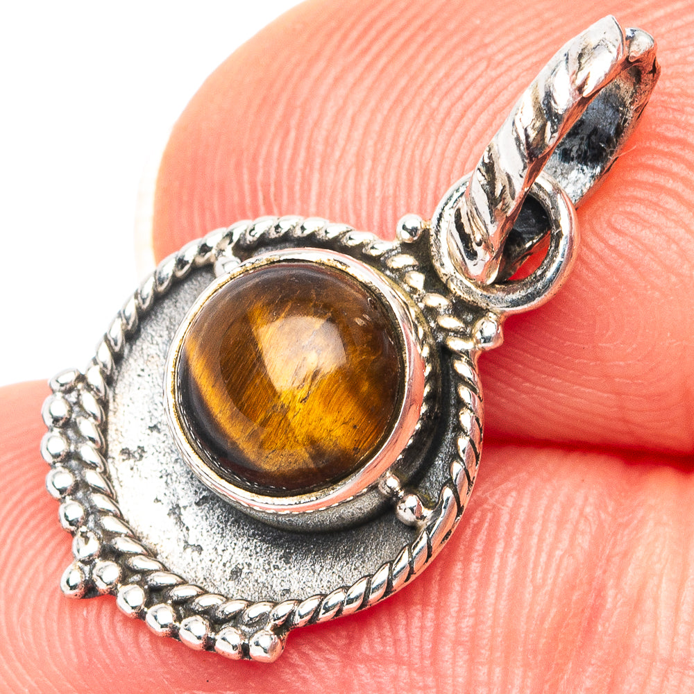 Sterling silver tiger’s eye pendant with amber oval stone, ornate bezel
