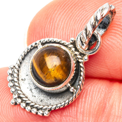 Sterling silver tiger’s eye pendant with amber oval stone, ornate bezel