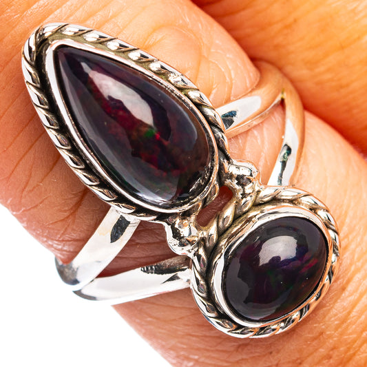 Sterling silver double oval gemstone ring with ornate filigree, two dark stones