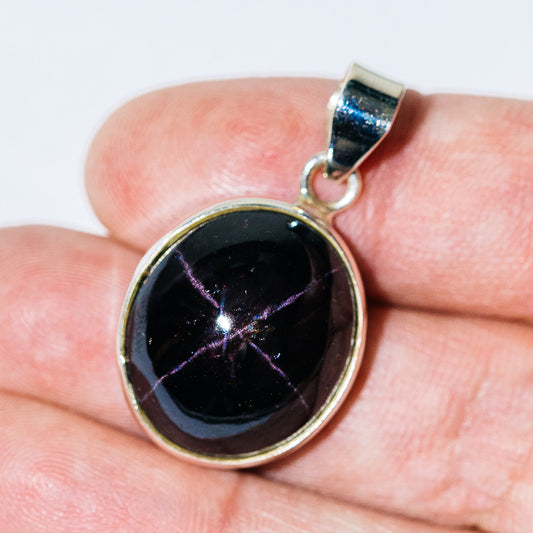Round star garnet cabochon pendant in .925 sterling silver bezel