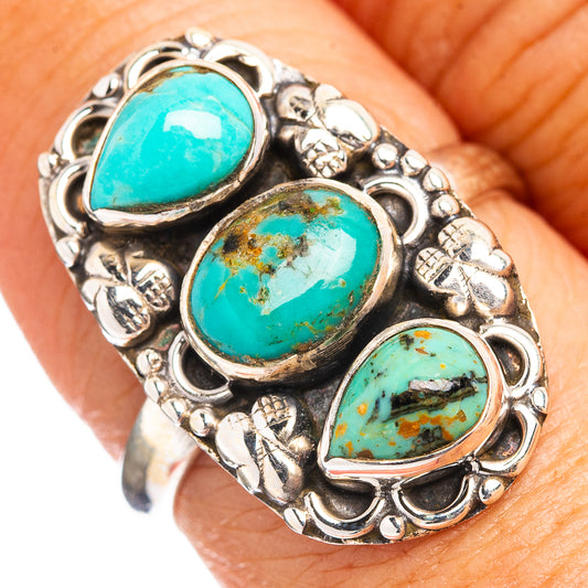 Adjustable sterling silver ring with three oval turquoise cabochons and ornate settings